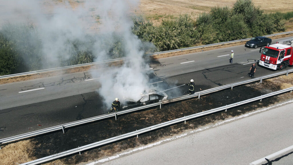 firefighters-extinguish-burning-car-on-highway-following-serious-car-accident-on-hot-s-SBI-350592052 | Law Office of Eric Andrew Mercer