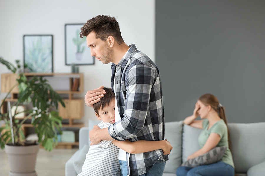 Man calming his son after family quarrel at home | Law Office of Eric Andrew Mercer Custody Order Violations in California